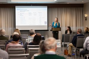 Alexandra Rozen (at podium) and Chelsea Conlon, Engineers with JKMuir, give a presentation at the New England Water Environment Association meeting in January.